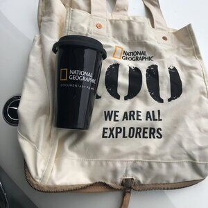 National Geographic Bag and ceramic mug. NEW. Bag can be zipped to pocket size!